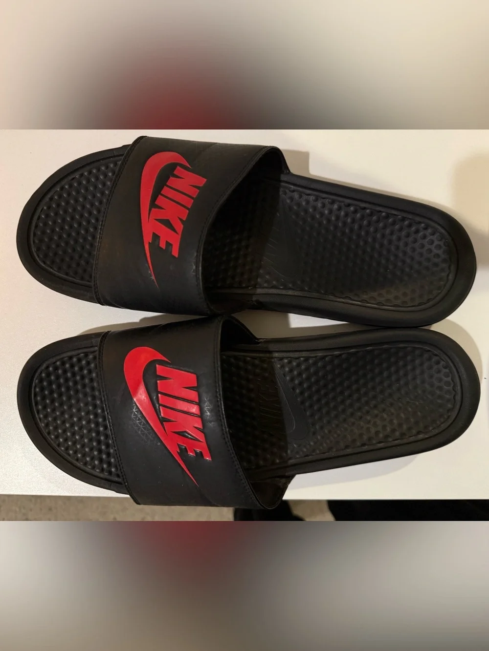Nike Black Slide Sandals with Red Logo Accent